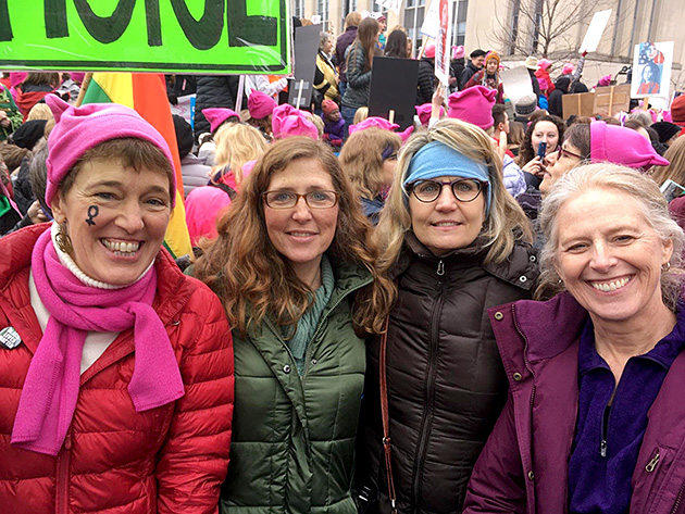 photo of four women at a women's march